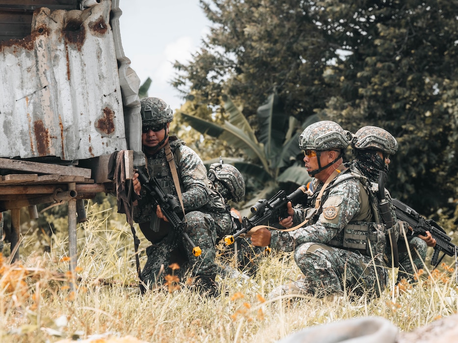 Philippine Marines with 3rd Marine Brigade, Philippine Marine Corps, kneel behind cover during a Maritime Key Terrain Security Operations event in support of Exercise Balikatan 25 near Puerto Princesa, Palawan, Philippines, May 5, 2025.