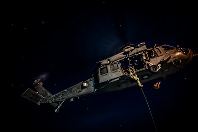 SOUTH CHINA SEA (May 11, 2025) — Members of Explosive Ordnance Disposal Mobile Unit 11 fast-rope out of an MH-60S Sea Hawk helicopter from the “Indians” of Helicopter Sea Combat Squadron (HSC) 6 onto the flight deck of the aircraft carrier USS...