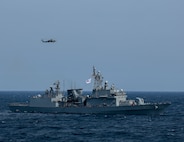 AT SEA (May, 8, 2025) - The first-in-class destroyer ROKS Gwangaeto the Great (DDH 971) and MH-60R Seahawk assigned to the "Blue Hawks" of Helicopter Maritime Strike Squadron (HSM) 78 operate together during Maritime Counter Special Operations Exercise (MCSOFEX) May, 8, 2025. MCSOFEX is a high-profile exercise focused on readiness and shaping the maritime domain to achieve both U.S. and the Republic of Korea cooperation objectives. William P. Lawrence is deployed and assigned to Destroyer Squadron (DESRON) 15, the Navy’s largest DESRON and the U.S. 7th Fleet’s principal surface force. (U.S. Navy photo by Mass Communication Specialist 3rd Class Gavin Arnoldhendershot)