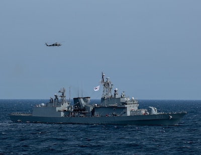 AT SEA (May, 8, 2025) - The first-in-class destroyer ROKS Gwangaeto the Great (DDH 971) and MH-60R Seahawk assigned to the "Blue Hawks" of Helicopter Maritime Strike Squadron (HSM) 78 operate together during Maritime Counter Special Operations Exercise (MCSOFEX) May, 8, 2025. MCSOFEX is a high-profile exercise focused on readiness and shaping the maritime domain to achieve both U.S. and the Republic of Korea cooperation objectives. William P. Lawrence is deployed and assigned to Destroyer Squadron (DESRON) 15, the Navy’s largest DESRON and the U.S. 7th Fleet’s principal surface force. (U.S. Navy photo by Mass Communication Specialist 3rd Class Gavin Arnoldhendershot)