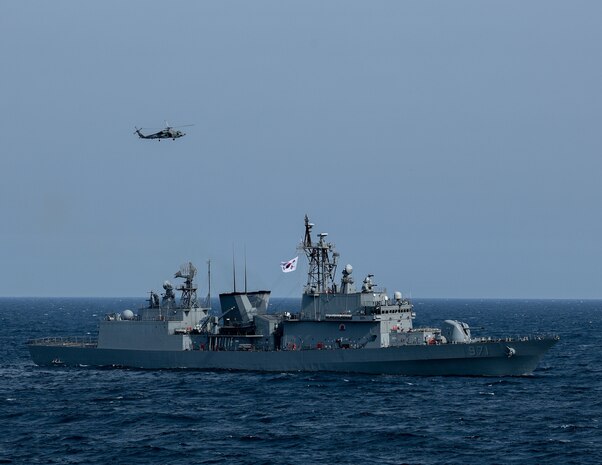 AT SEA (May, 8, 2025) - The first-in-class destroyer ROKS Gwangaeto the Great (DDH 971) and MH-60R Seahawk assigned to the "Blue Hawks" of Helicopter Maritime Strike Squadron (HSM) 78 operate together during Maritime Counter Special Operations Exercise (MCSOFEX) May, 8, 2025. MCSOFEX is a high-profile exercise focused on readiness and shaping the maritime domain to achieve both U.S. and the Republic of Korea cooperation objectives. William P. Lawrence is deployed and assigned to Destroyer Squadron (DESRON) 15, the Navy’s largest DESRON and the U.S. 7th Fleet’s principal surface force. (U.S. Navy photo by Mass Communication Specialist 3rd Class Gavin Arnoldhendershot)