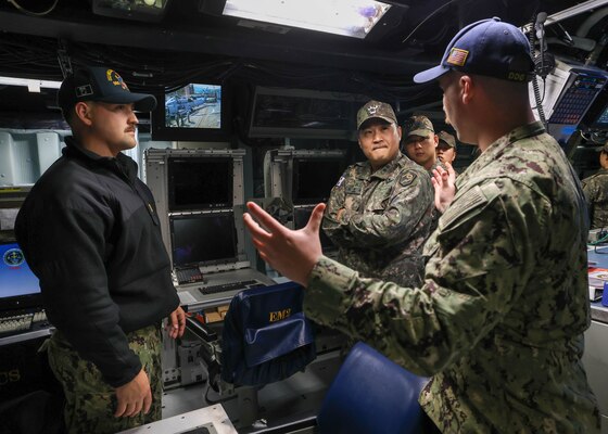 DONGHAE, Republic of Korea (May 7, 2025) - Republic of Korea (ROK) Army service members receive a tour of the combat information center aboard the Arleigh Burke-class guided-missile destroyer USS William P. Lawrence (DDG 110) during the in-port period of Maritime Counter Special Operations Exercise (MCSOFEX), May 7, 2025. MCSOFEX is a high profile exercise focused on readiness and shaping the maritime domain to achieve both U.S. and ROK cooperation objectives. William P. Lawrence is deployed and assigned to Destroyer Squadron (DESRON) 15, the Navy’s largest DESRON and the U.S. 7th Fleet’s principal surface force. (U.S. Navy photo by Mass Communication Specialist 3rd Class Gavin Arnold Hendershot)
