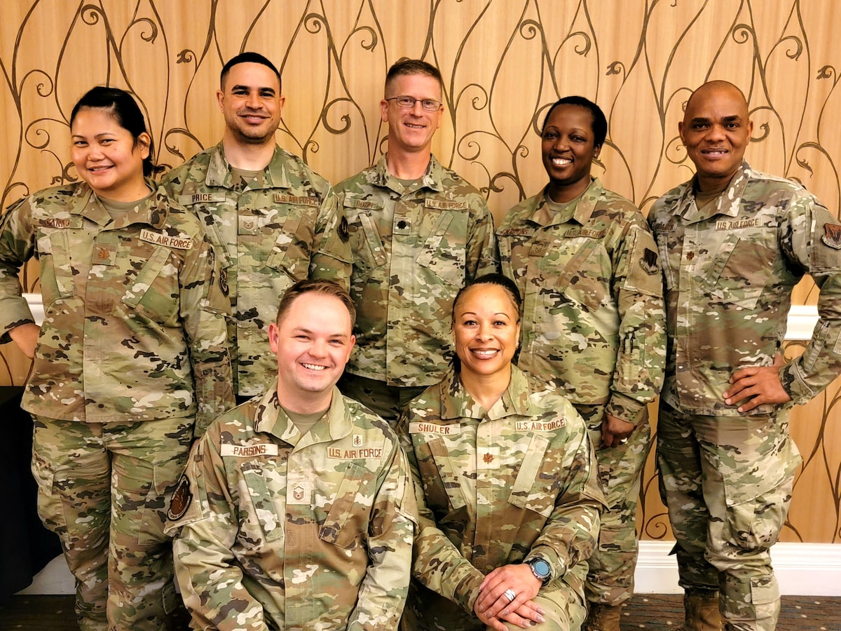 Image of a group of Airmen posing for a photo.