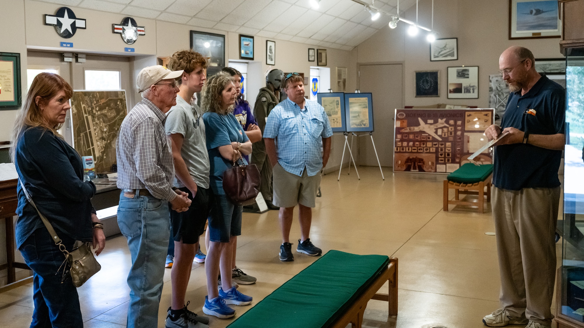 Relatives of Lt. Col. William E. Dyess learn about his history during a tour at Dyess Air Force Base, Texas, May 9, 2025. The relatives toured the base while traveling through Abilene, Texas. (U.S. Air Force photo by Airman 1st Class Jade M. Caldwell)