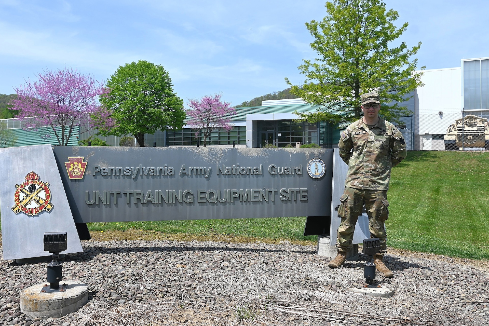 Pfc. Scott Gabner poses for a photogram outside the Unit Training Equipment Site at Fort Indiantown Gap, Pa., on April 29, 2025. Gabner, a graduate of the Keystone State Challenge Academy, is a wheeled vehicle mechanic with Delta Co., 128th Brigade Support Battalion, 2nd Infantry Brigade Combat Team and works full-time as a mechanic at UTES. (Pennsylvania National Guard photo by Brad Rhen)