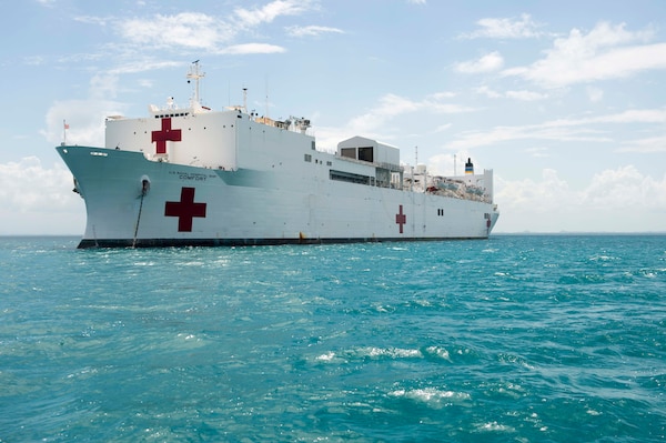 The Military Sealift Command hospital ship USNS Comfort (T-AH 20) sit at anchor during Continuing Promise 2015. Continuing Promise is a U.S. Southern Command-sponsored and U.S. Naval Forces Southern Command/U.S. 4th Fleet-conducted deployment to conduct civil-military operations including humanitarian-civil assistance, subject matter expert exchanges, medical, dental, veterinary and engineering support and disaster response to partner nations and to show U.S. support and commitment to Central and South America and the Caribbean. (U.S. Navy photo by Mass Communication Specialist 1st Class Gary Johnson/Released)