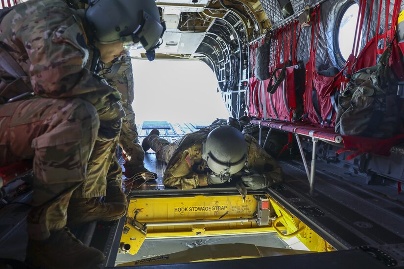 Soldiers with the Pennsylvania National Guard’s 28th Expeditionary Combat Aviation Brigade crewed a CH-47 Chinook helicopter to assist the U.S. Coast Guard by transporting three buoys May 7 in the Chesapeake Bay and Delaware Bay. During the winter, buoys are often displaced and washed up on beaches that are inaccessible to Coast Guard boats. (U.S. Army National Guard photo by Sgt. 1st Class Zane Craig)