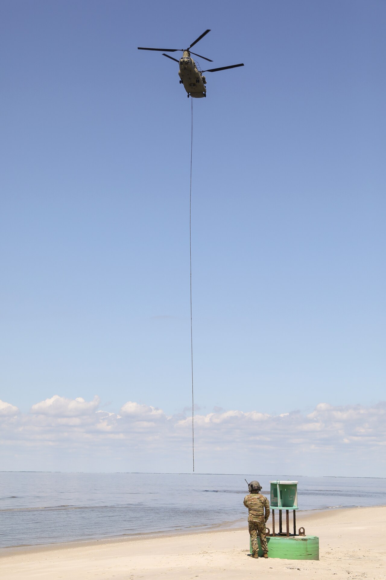 Soldiers with the Pennsylvania National Guard’s 28th Expeditionary Combat Aviation Brigade crewed a CH-47 Chinook helicopter to assist the U.S. Coast Guard by transporting three buoys May 7 in the Chesapeake Bay and Delaware Bay. During the winter, buoys are often displaced and washed up on beaches that are inaccessible to Coast Guard boats. (U.S. Army National Guard photo by Sgt. 1st Class Zane Craig)