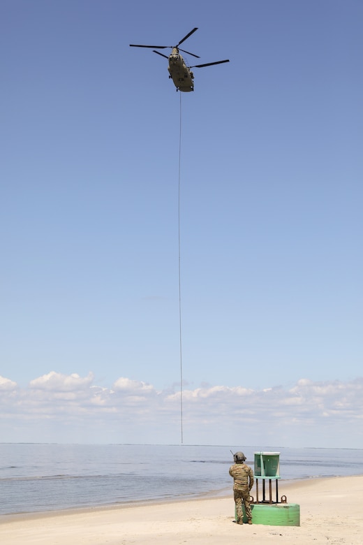 Soldiers with the Pennsylvania National Guard’s 28th Expeditionary Combat Aviation Brigade crewed a CH-47 Chinook helicopter to assist the U.S. Coast Guard by transporting three buoys May 7 in the Chesapeake Bay and Delaware Bay. During the winter, buoys are often displaced and washed up on beaches that are inaccessible to Coast Guard boats. (U.S. Army National Guard photo by Sgt. 1st Class Zane Craig)