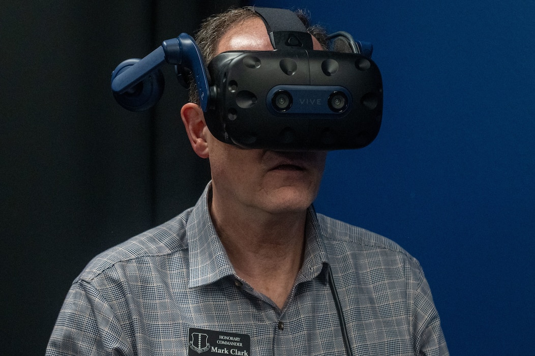 Mark Clark, 17th Training Wing honorary commander, tries a virtual reality simulation training at U.S. Space Force 533rd Training Squadron Detachment 1 at Goodfellow Air Force Base, Texas, May 8, 2025. The VR simulations are designed to place trainees in realistic operational scenarios, increasing both engagement and job-specific learning. (U.S. Air Force photo by Airman 1st Class James Salellas)