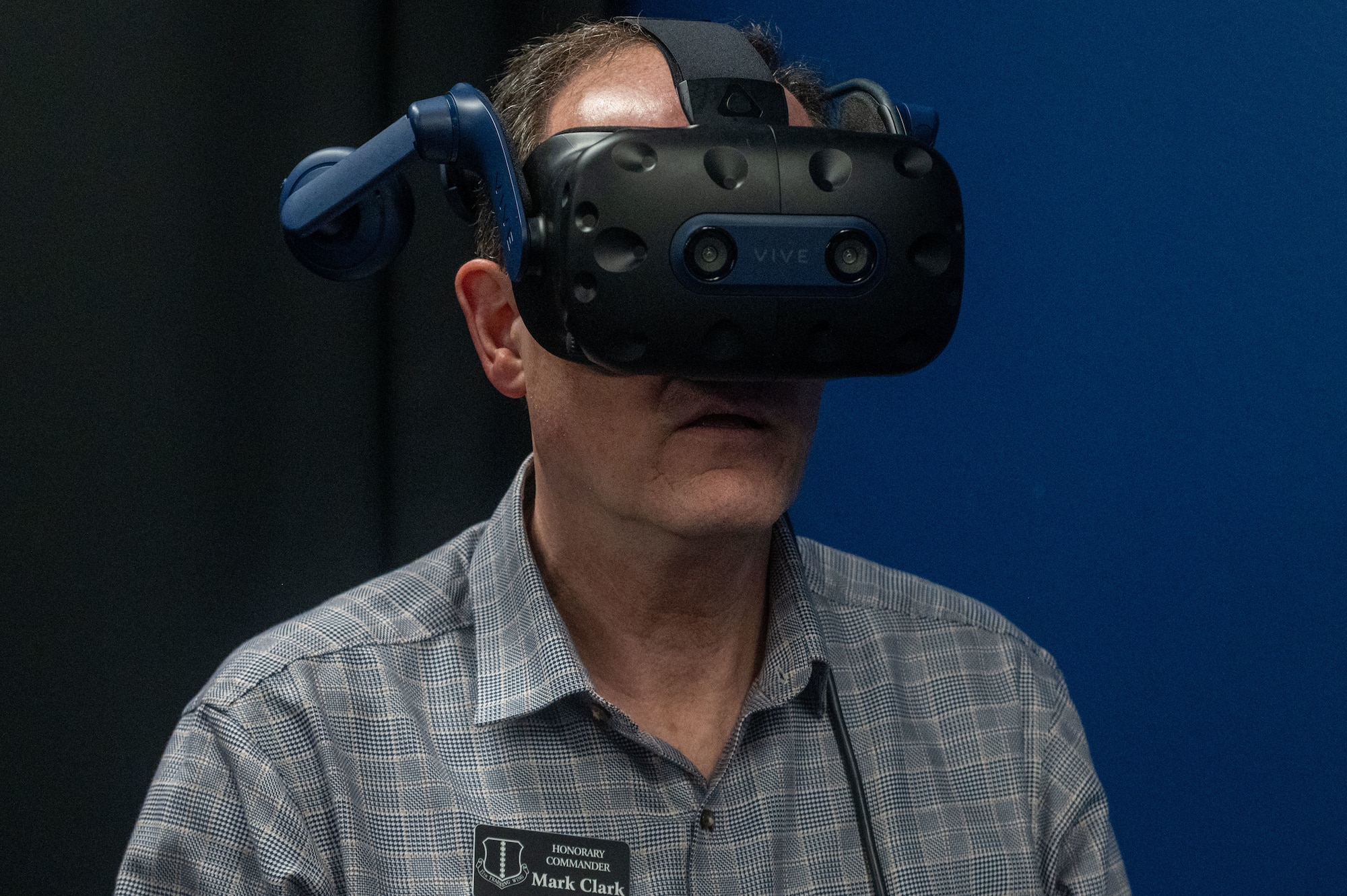 Mark Clark, 17th Training Wing honorary commander, tries a virtual reality simulation training at U.S. Space Force 533rd Training Squadron Detachment 1 at Goodfellow Air Force Base, Texas, May 8, 2025. The VR simulations are designed to place trainees in realistic operational scenarios, increasing both engagement and job-specific learning. (U.S. Air Force photo by Airman 1st Class James Salellas)