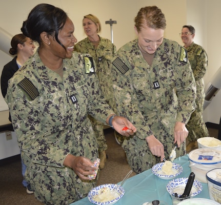 Confectionary for the corps…Navy Nurse Corps officers Lt. Mikala Tracy and Lt. Jill Becker assigned to NMRTC Bremerton take a brief respite for a ice cream social to recognize all command nurses, promote shared purpose and camaraderie and honor the 117 years anniversary of their corps commitment to mission readiness (Official Navy photo by Douglas H Stutz, NHB/NMRTC Bremerton public affairs officer).