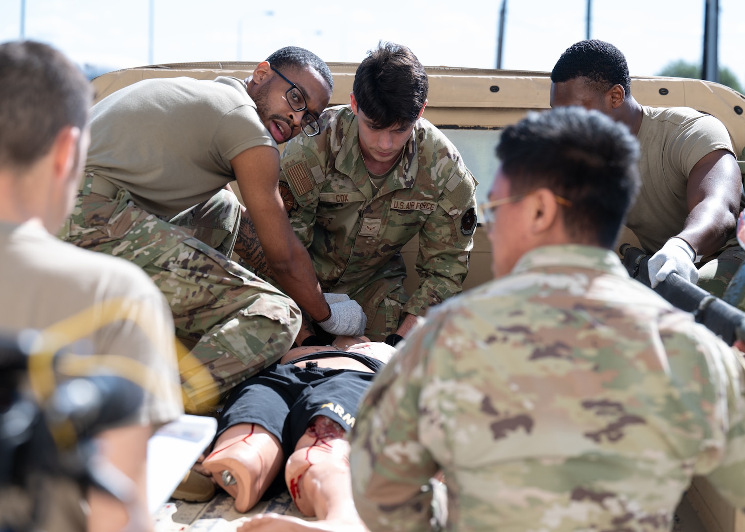 U.S. Air Force medics apply Tactical Combat Casualty Care techniques during a simulated battlefield scenario May 9, 2025, at Joint Base San Antonio-Lackland, Texas.