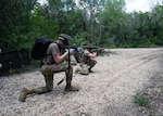 U.S. Air Force Airmen tends to asimulated  casualty under simulated fire during Tactical Combat Casualty Care Skills Day, held May 9, 2025, at Joint Base San Antonio-Lackland, Texas.