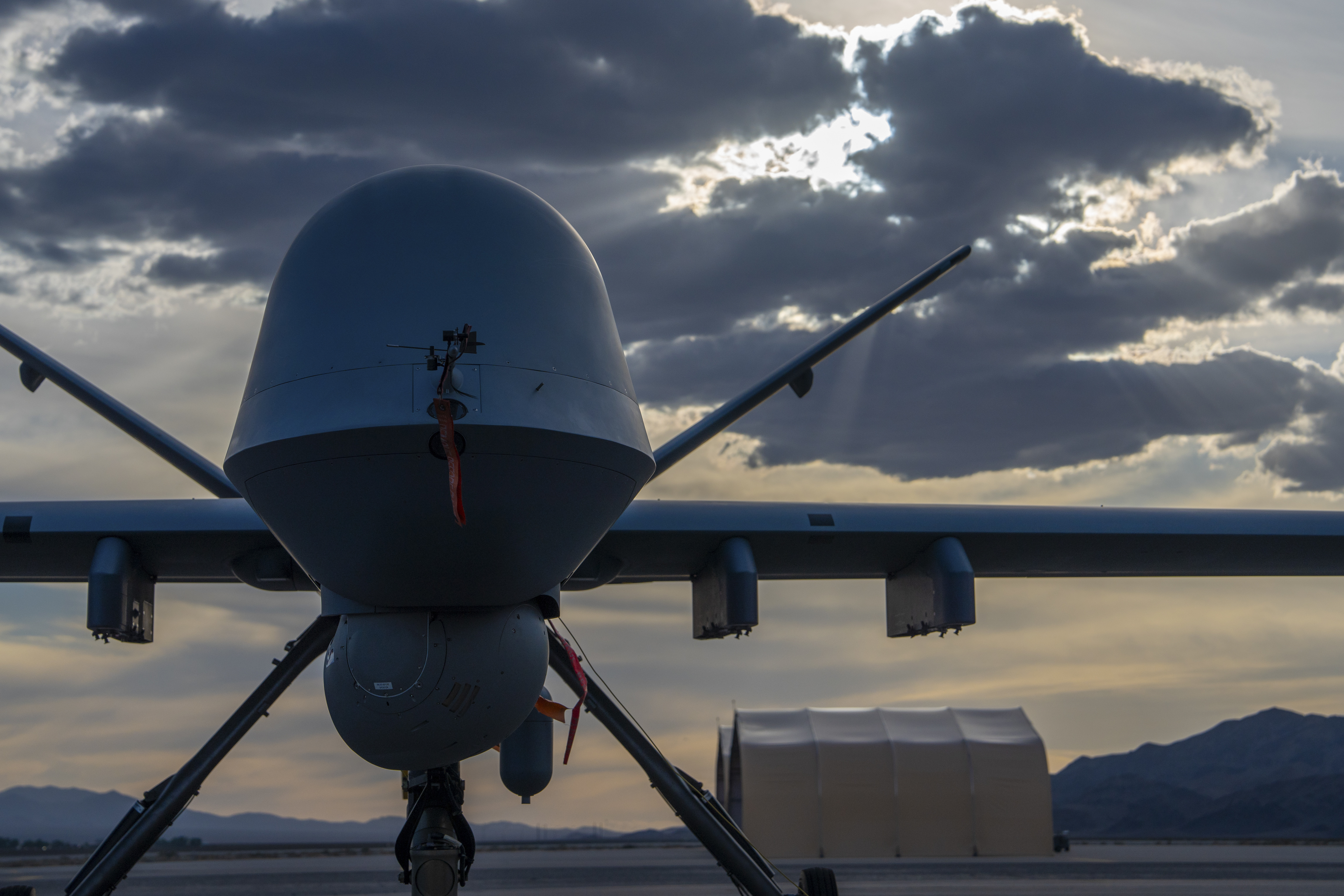 An MQ-9 Reaper remotely piloted aircraft sits on the flightline at Creech Air Force Base, Nevada, April 15, 2025. The MQ-9 Reaper performs the following missions and tasks: intelligence, surveillance, reconnaissance, close air support, combat search and rescue, precision strike, buddy-lase, convoy/raid overwatch, target development, and terminal air guidance. (U.S. Air Force photo by Senior Airman Victoria Nuzzi)
