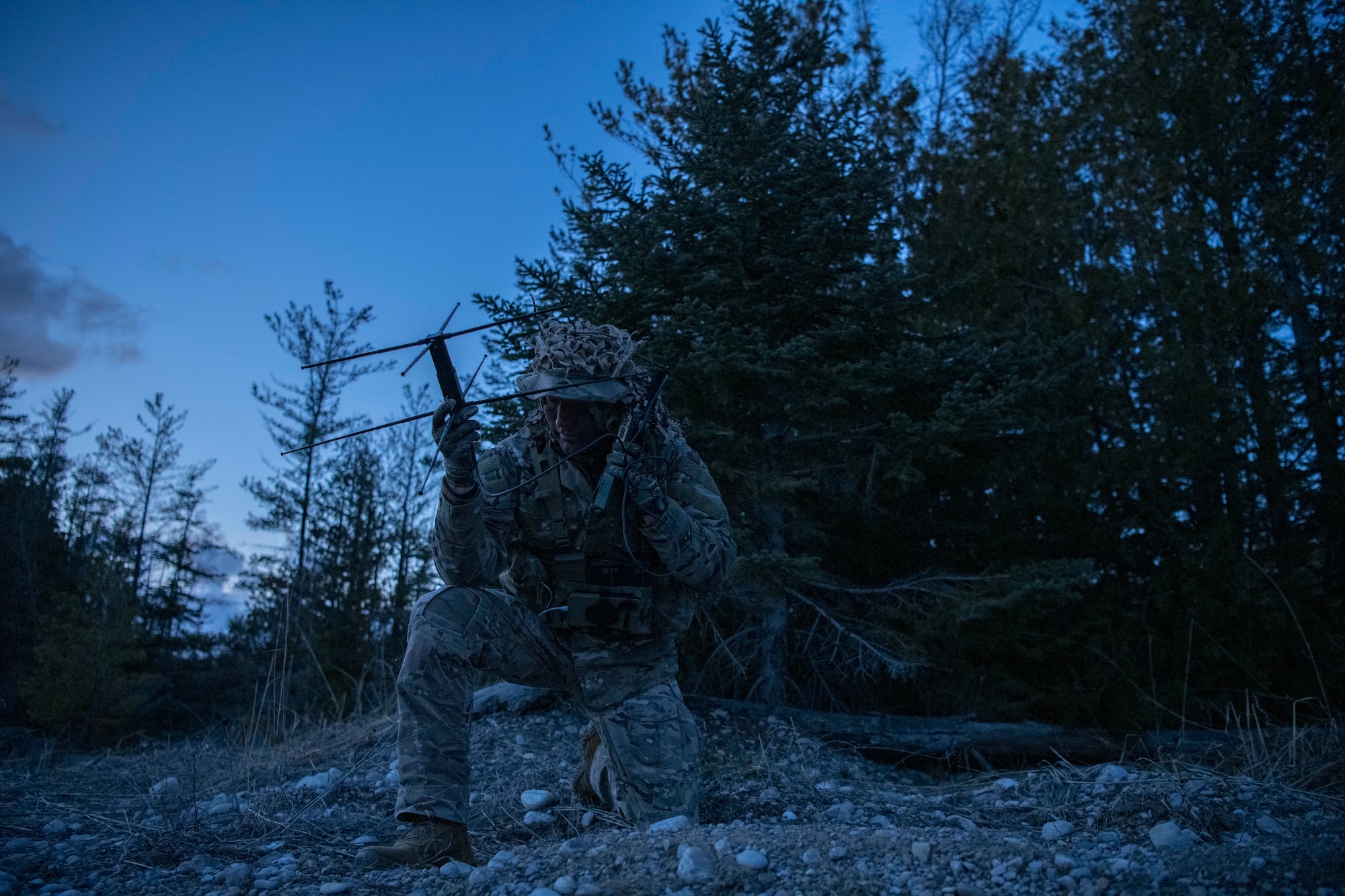 An Airman uses a radio