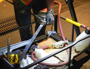 A contractor with Navy Closure Task Force-Red Hill (NCTF-RH) prepares a pneumatic hacksaw for pipe removal operations in support of the safe and deliberate decommissioning of the Red Hill Bulk Fuel Storage Facility (RHBFSF) in Honolulu, May 5, 2025. Charged with the safe decommissioning of the facility, NCTF-RH was established by the Department of the Navy as a commitment to the community and the environment. NCTF-RH continues to engage with the people of Hawaii, regulatory agencies, and other stakeholders as it safely and deliberately decommissions the RHBFSF. (U.S. Navy photo by Mass Communication Specialist 1st Class Glenn Slaughter)