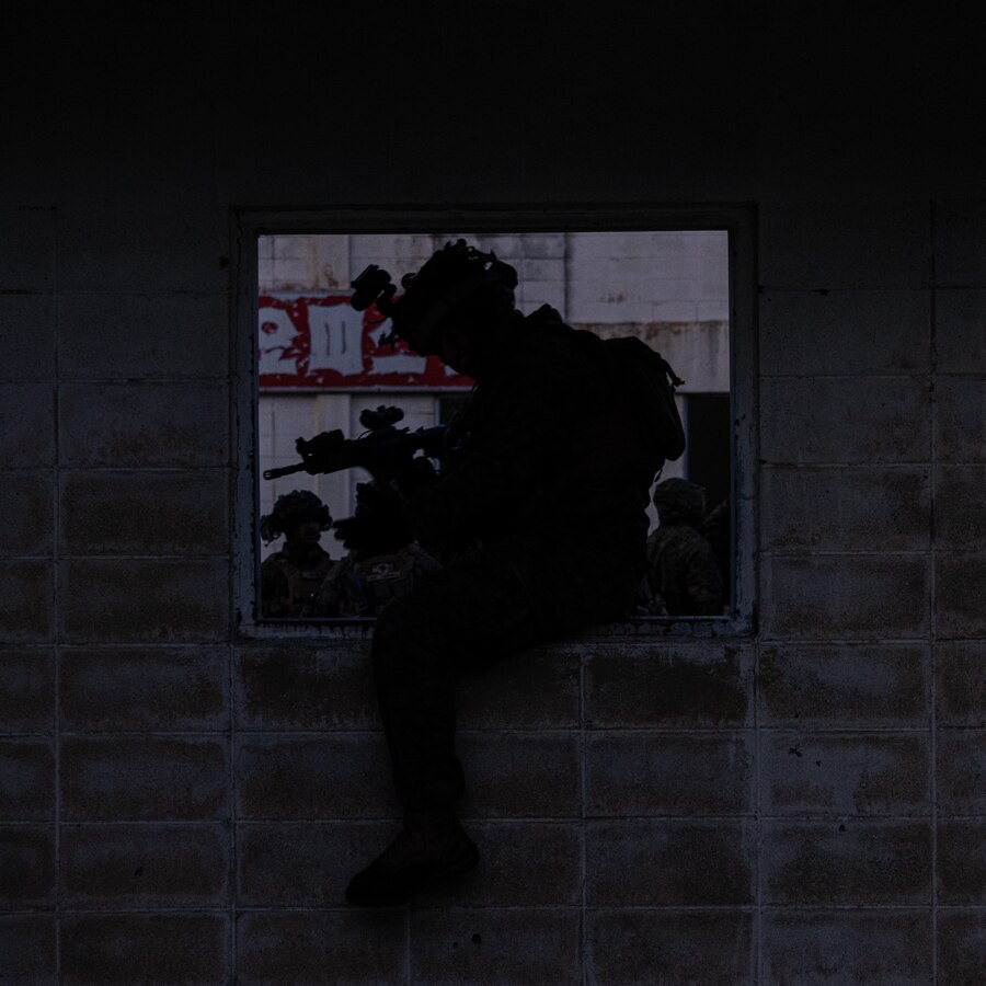 A U.S. Marine with 2nd Battalion, 23rd Marines, forward deployed with 4th Marine Regiment, 3d Marine Division as part of the Unit Deployment Program, enters a window into a building during room clearing drills as a part of military operations in urban terrain training during Korea Viper 25.4 at Pohang, South Korea, May 3, 2025. Korea Viper is a recurring exercise series that demonstrates the Republic of Korea and U.S. Marine Corps' ability to respond decisively in the region as a singular, unified force while strengthening relationships and trust between the two allies. (U.S. Marine Corps photo by Lance Cpl. Tucker Mocan)