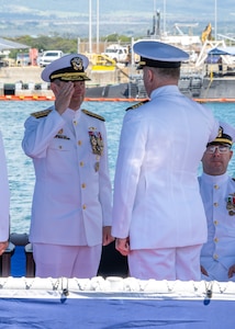 JOINT BASE PEARL HARBOR-HICKAM, Hawaii (May 9, 2025) - Rear Adm. Chris Cavanaugh, commander, Submarine Force, U.S. Pacific Fleet, receives report of relief from Capt. Chris Hedrick, incoming commander, Submarine Squadron (CSS) 1, aboard the Virginia-class fast-attack submarine USS Vermont (SSN 792), during the change of command ceremony for CSS-1, May 9, 2025. CSS-1 is composed of six Virginia-class fast-attack submarines, which are capable of supporting various missions, including anti-submarine warfare, anti-surface ship warfare, strike warfare, special operations forces support, and intelligence, surveillance, and reconnaissance. (U.S. Navy photo by Mass Communication Specialist 1st Class Scott Barnes)