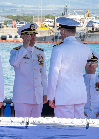 JOINT BASE PEARL HARBOR-HICKAM, Hawaii (May 9, 2025) - Rear Adm. Chris Cavanaugh, commander, Submarine Force, U.S. Pacific Fleet, receives report of relief from Capt. Chris Hedrick, incoming commander, Submarine Squadron (CSS) 1, aboard the Virginia-class fast-attack submarine USS Vermont (SSN 792), during the change of command ceremony for CSS-1, May 9, 2025. CSS-1 is composed of six Virginia-class fast-attack submarines, which are capable of supporting various missions, including anti-submarine warfare, anti-surface ship warfare, strike warfare, special operations forces support, and intelligence, surveillance, and reconnaissance. (U.S. Navy photo by Mass Communication Specialist 1st Class Scott Barnes)