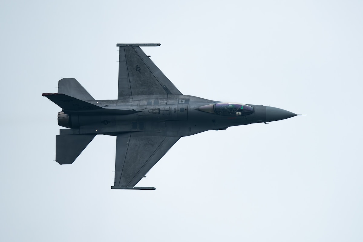 F-16 fighter jet flies through the sky
