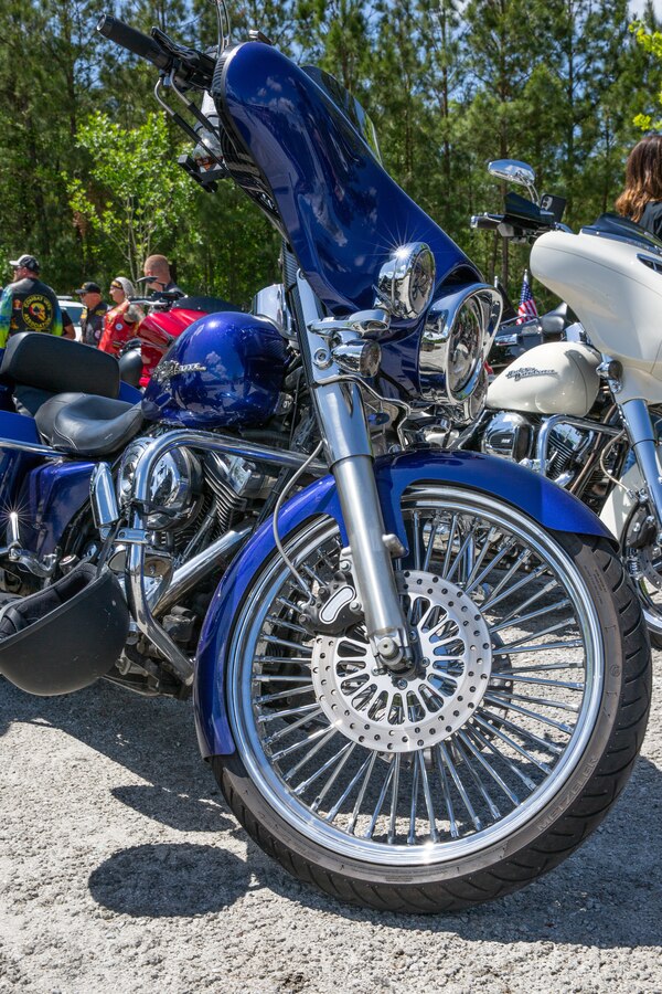 A motorcycle is parked at Wallace Creek Fitness Center for Operation Never Forget Flag Display on Marine Corps Base Camp Lejeune, North Carolina, May 3, 2025. The Operation Never Forget flag serves as a powerful tribute to our fallen heroes—service members are encouraged to sign it and add their unit patches as a symbol of unity, remembrance, and unwavering commitment to honor those who made the ultimate sacrifice. (U.S. Marine Corps photo by Lance Cpl. Devaraja Renshaw)