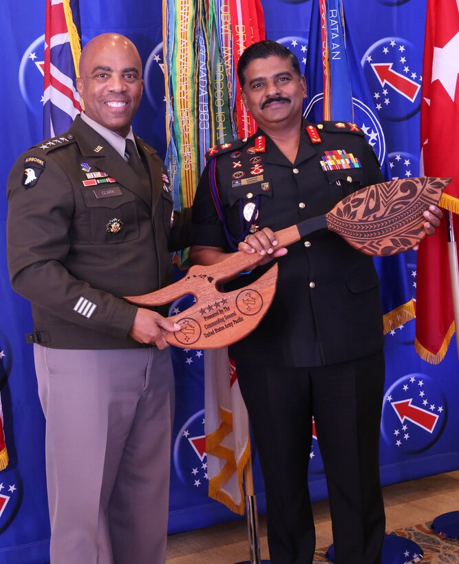 U.S. Army Gen. Ronald Clark (left), Commanding General of USARPAC, and Lt Gen. Lasantha Rodrigo, Commander of the Sri Lanka Army, participate in a gift exchange during the 2025 Land Forces Pacific Symposium and Exposition (LANPAC), Honolulu, Hawaii, May 13, 2025.