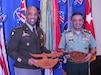 U.S. Army Gen. Ronald Clark (left), Commanding General of USARPAC, and Gen. Muhammad Hafizuddeain (right), Chief of Malaysian Army, participate in a gift exchange during the 2025 Land Forces Pacific Symposium and Exposition (LANPAC), Honolulu, Hawaii, May 14, 2025.
