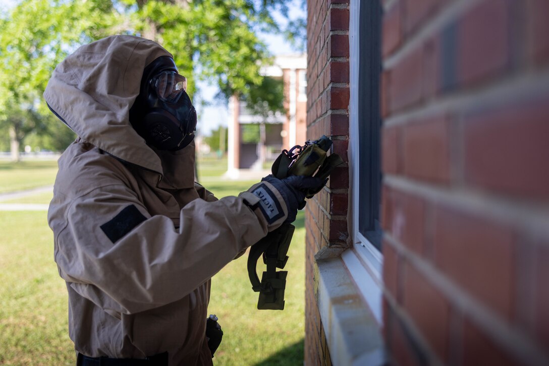 U.S. Marine Corps Lance Cpl. Anthony Sevret, a chemical, biological, radiological and nuclear specialist with Headquarters and Service Battalion, 2nd Marine Logistics Group, uses a joint chemical agent detector to conduct reconnaissance of a building during a simulated CBRN response exercise at Marine Corps Base Camp Lejeune, North Carolina, May 14, 2025. This hands-on exercise allowed CBRN specialists to practice conducting reconnaissance, sampling and collecting CBRN materials, and decontamination after coming in contact with simulated live agents. (U.S. Marine Corps photo by Sgt. Alfonso Livrieri)