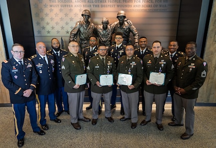 Ten New York Army National Guard Soldiers who received the Purple Heart on May 10, 2025 at the Purple Heart Hall of Honor in New Windsor, New York display their certificates following the ceremony. The ten Soldiers were injured during a January 28, 2024 drone attack on a military outpost in Jordan known as Tower 22.