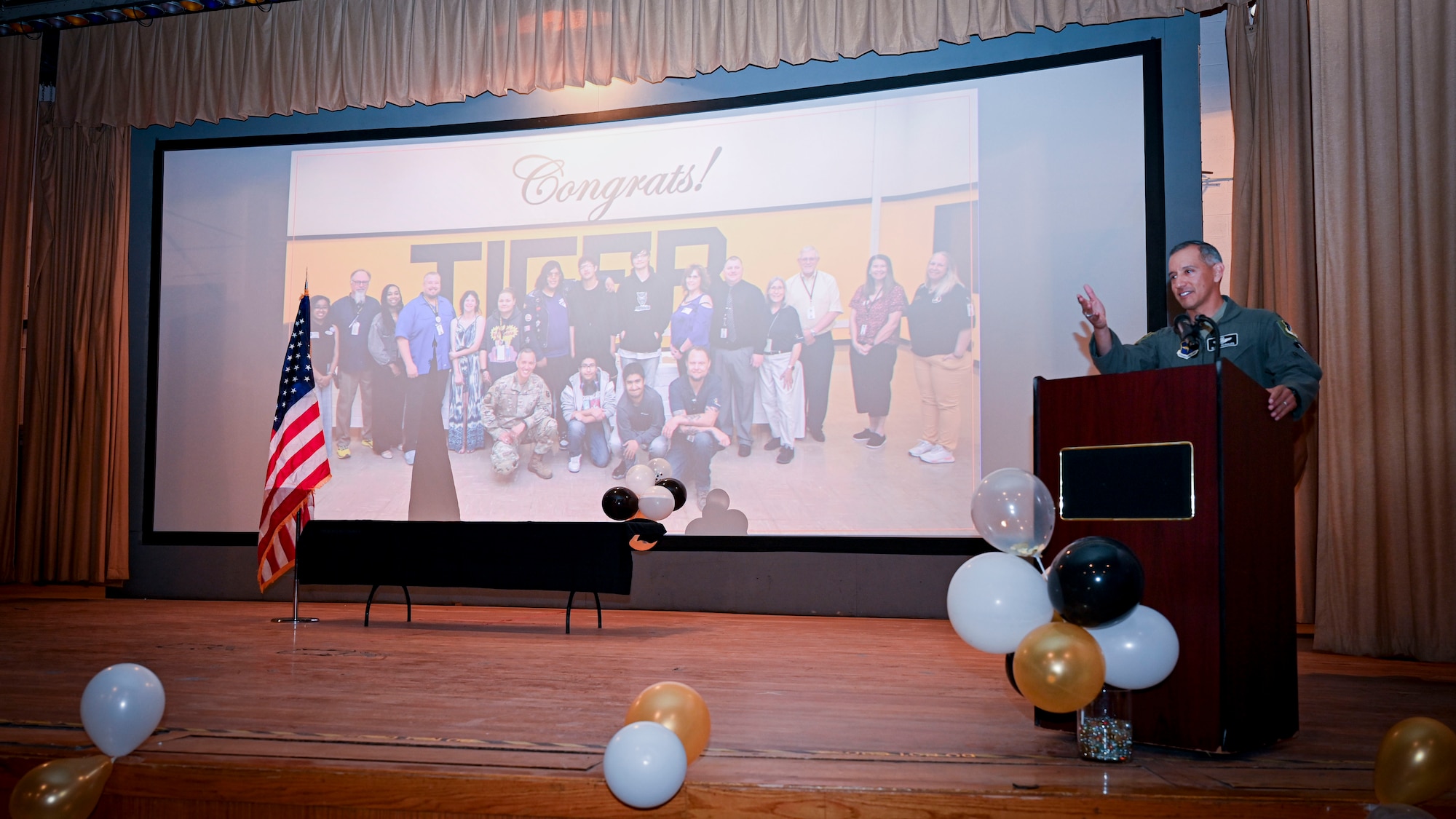 U.S. Air Force Col. Rosales, 49th Wing deputy commander, gives a speech during the Project SEARCH graduation ceremony at Holloman Air Force Base, New Mexico, May 13, 2025. Project SEARCH integrates 18-22 year olds with disabilities into working environments to help them gain valuable work experience. (U.S. Air Force photo by Senior Airman Class Michelle Ferrari)