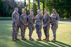 Recipients of the Diamond Sharp team award pose for a photo at Ramstein Air Base, Germany, May 15, 2025. When one woman found herself far from home, injured and alone, a community of sisters she had never met rose up to stand beside her. Their mission wasn’t written in an operation manual, nor was it a tasking order from leadership. It was a calling from the heart, a testament to the strength of sisterhood and the quiet power of simply showing up. (U.S. Air Force photo by Senior Airman Jared Lovett)