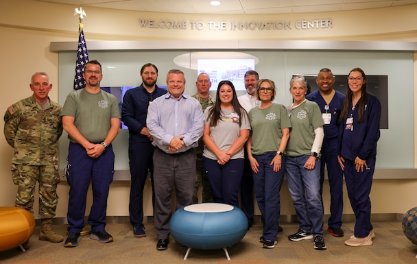 Seargeant Maj. Steven Walker and Master Sgt. Robert Maddaloni pose for a photo opportunity with Columbus Regional Health staff, May 13, 2025.