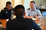 U.S. Air Force Lt. Col. Michael Kelly speaks with Royal Thai Air Force Airmen in an air domain awareness working group at an Airman-to-Airman Talks in Pattaya, Thailand, May 13, 2025. Airman-to-Airman Talks facilitate discussions between the U.S. and Thailand to share best practices and build stronger relationships through collaboration and planning.