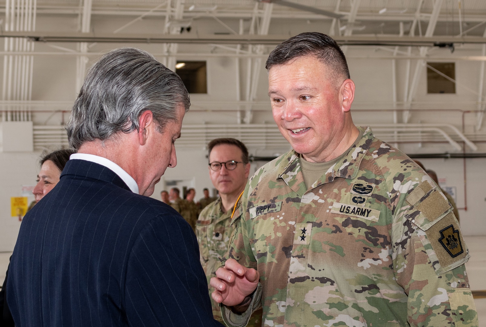 Army Maj. Gen. John R. Pippy, Pennsylvania adjutant general chat with attendees as the Pennsylvania National Guard’s 171st Air Refueling Wing, receives the of U.S. Strategic Command’s Omaha Trophy May 1, 2025.