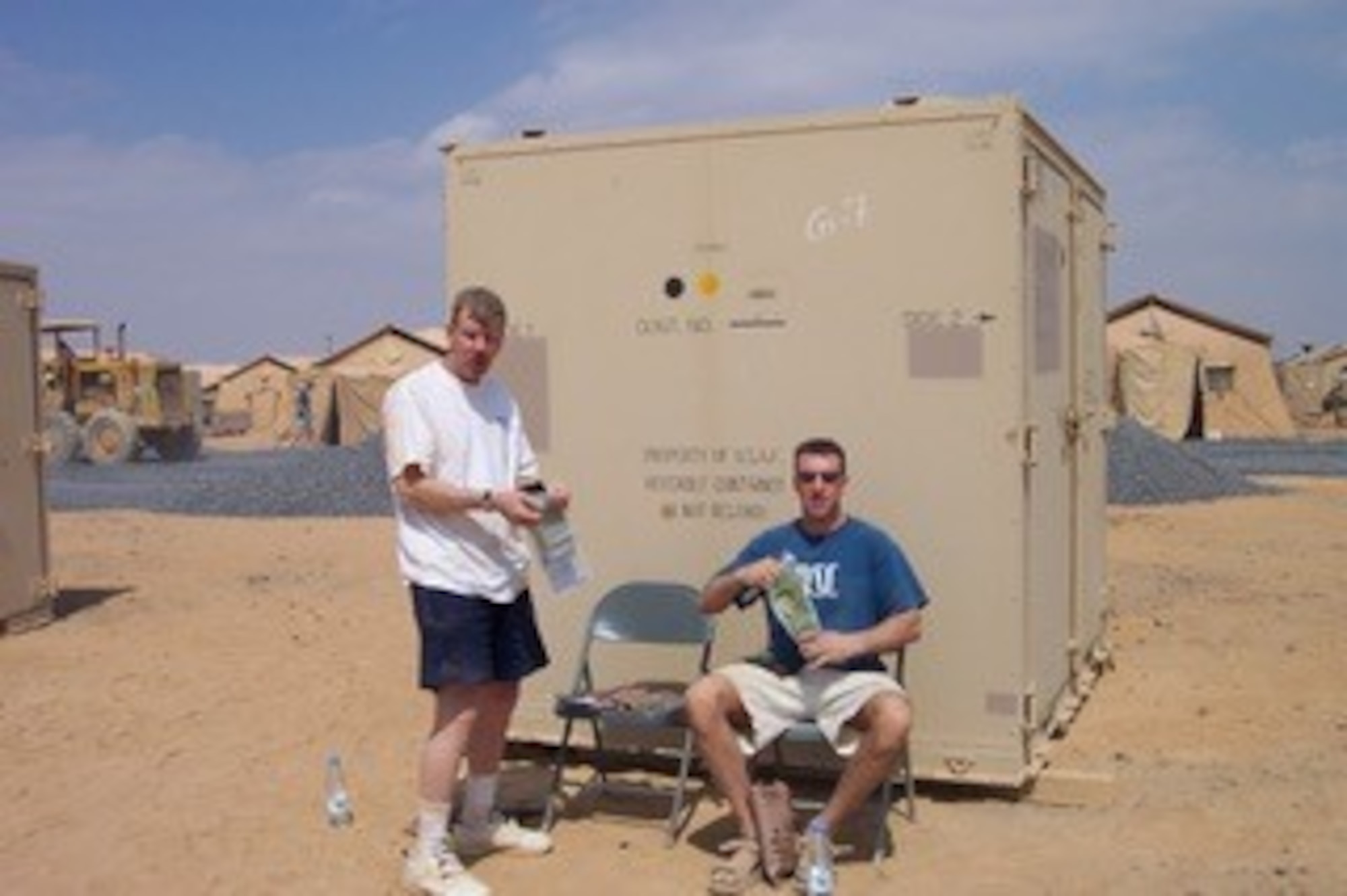 st Lt CJ Pfeil (right) poses with his father SMSgt Christopher Pfeil during a break on deployment. In between flying sorties the duo use their construction skills to build up the base in Saudi Arabia for 4,000 servicemembers. (US Air Force courtesy photo)