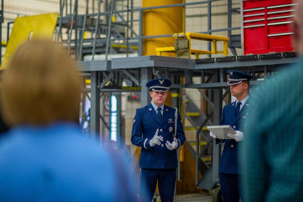 Two men dressed in their Air Force blues speak to a crowd.