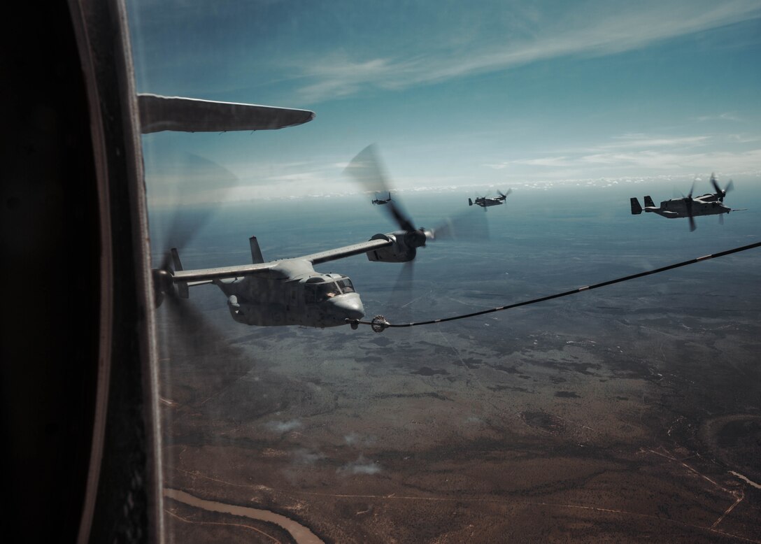 A U.S. Marine Corps KC-130J Super Hercules refuels four U.S. Marine Corps MV-22B Ospreys with Marine Medium Tiltrotor Squadron 363, Marine Rotational Force – Darwin 25.3, while traveling from Royal Australian Air Force Base Darwin to Royal Australian Air Force Base Townsville, Australia, May 6, 2025.