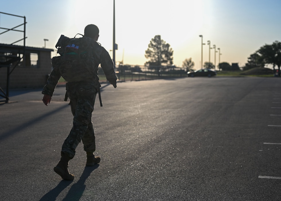A competitor walks towards the football field during the 2025 annual Norwegian Foot March at Goodfellow Air Force Base, Texas, May 3, 2025. Originating in 1915 as an endurance test for Norwegian armed forces, the 18.6-mile march allows participants to test their cardiovascular endurance and build esprit de corps. (U.S. Air Force photo by Senior Airman Evelyn J. D’Errico)