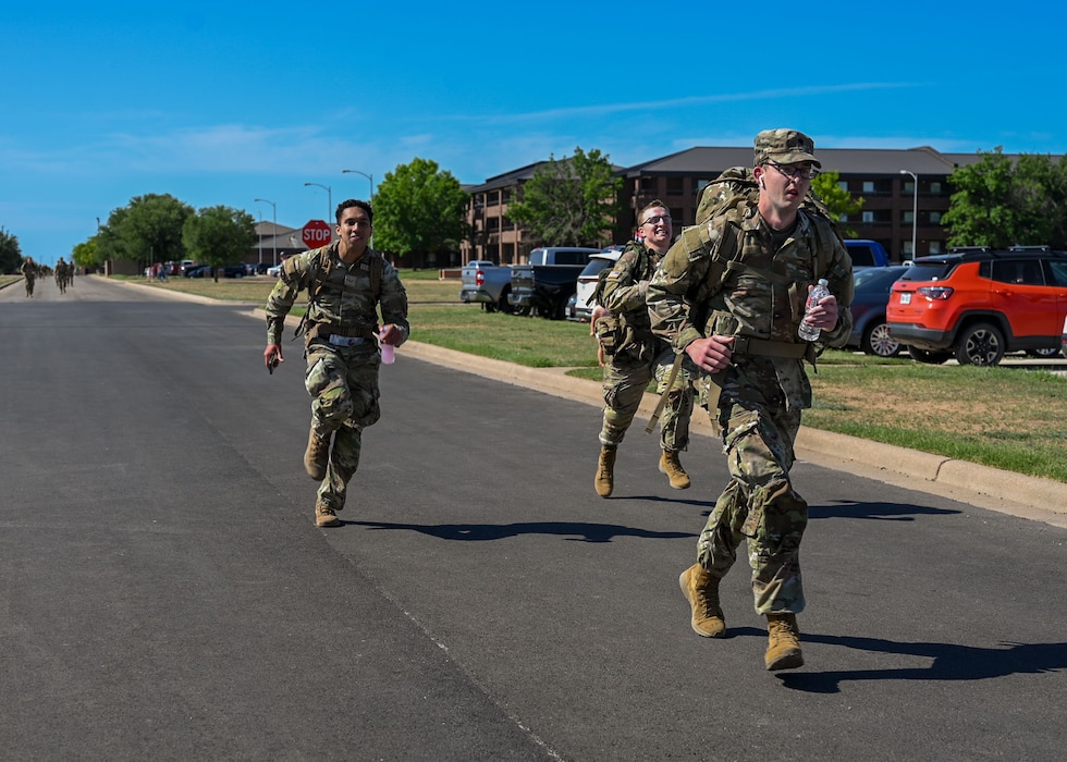 A 344th Military Intelligence Battalion soldier volunteers at the 2025 annual Norwegian Foot March at the 17th Security Forces Squadron warehouse during the 2025 Goodfellow Norwegian Foot March, Goodfellow Air Force Base, Texas, on May 3, 2025. The Norwegian Foot March is an 18.6-mile march with a ruck that weighs a minimum of 25 lbs and must be completed in less than 4.5 hours. (U.S. Air Force photo Senior Airman Evelyn J. D’Errico)