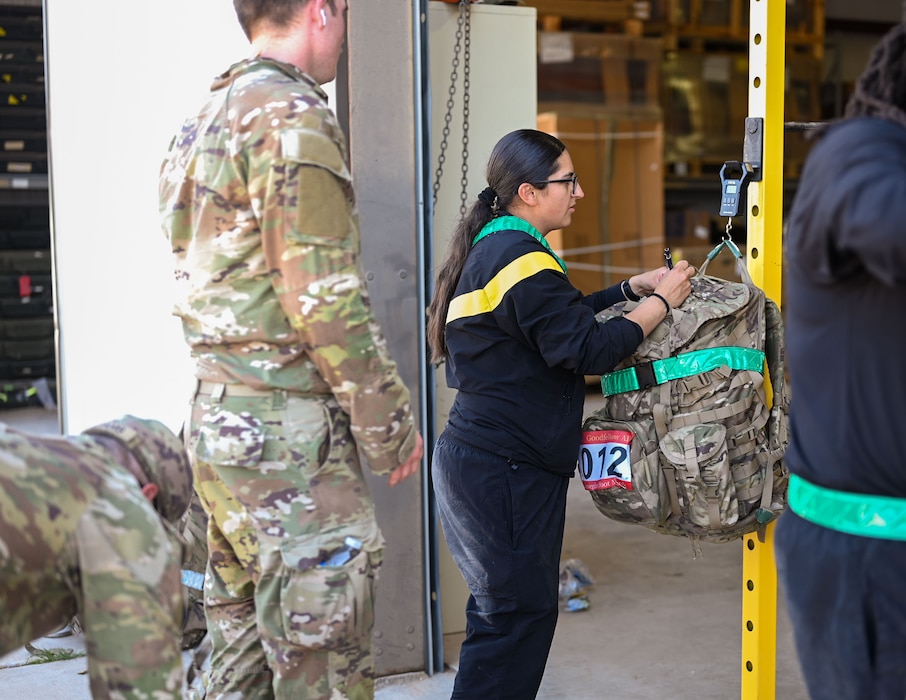A 344th Military Intelligence Battalion soldier volunteers at the 2025 annual Norwegian Foot March at the 17th Security Forces Squadron warehouse during the 2025 Goodfellow Norwegian Foot March, Goodfellow Air Force Base, Texas, on May 3, 2025. The Norwegian Foot March is an 18.6-mile march with a ruck that weighs a minimum of 25 lbs and must be completed in less than 4.5 hours. (U.S. Air Force photo Senior Airman Evelyn J. D’Errico)