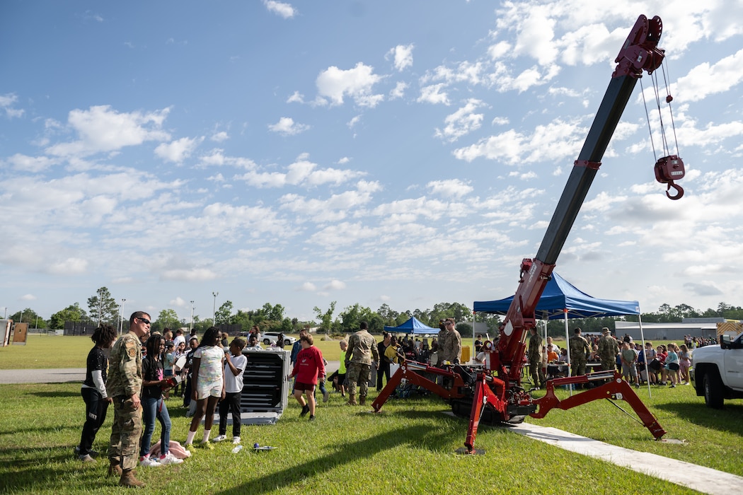 A student operates a crane.