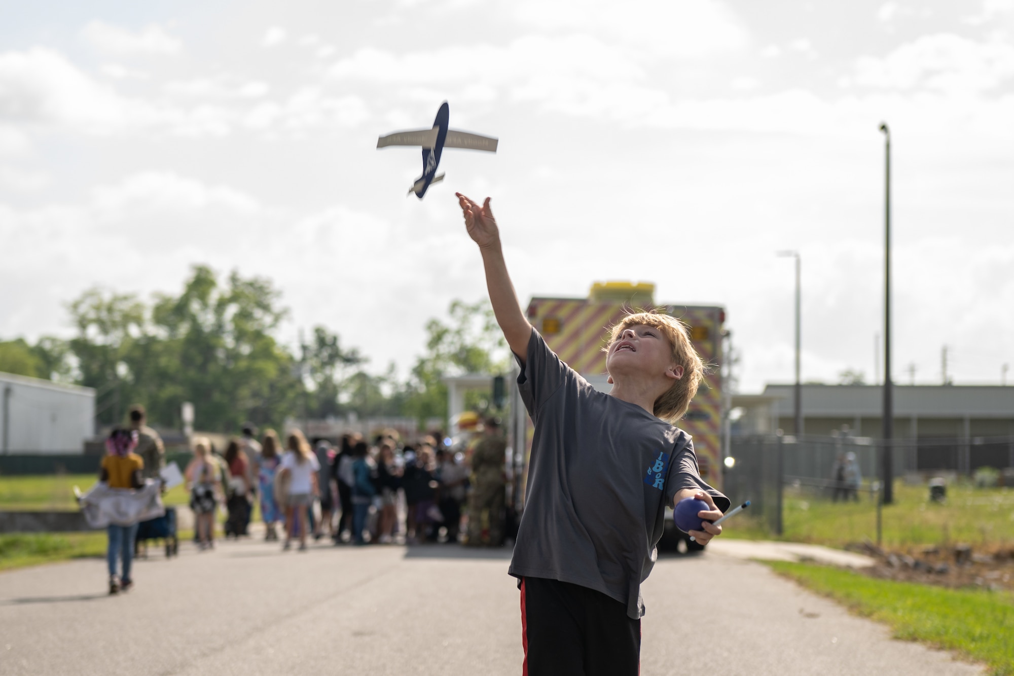 A student throwing a plane.