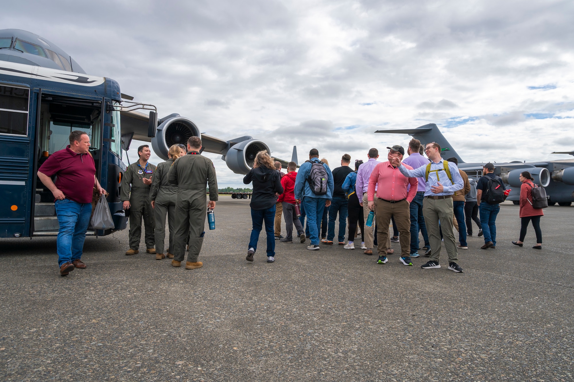 Sandia National Laboratories Weapon Intern Program participants and 62d Airlift Wing Airmen prepare to tour a C-17 Globemaster III at Joint Base Lewis-McChord, Washington, May 7, 2025.