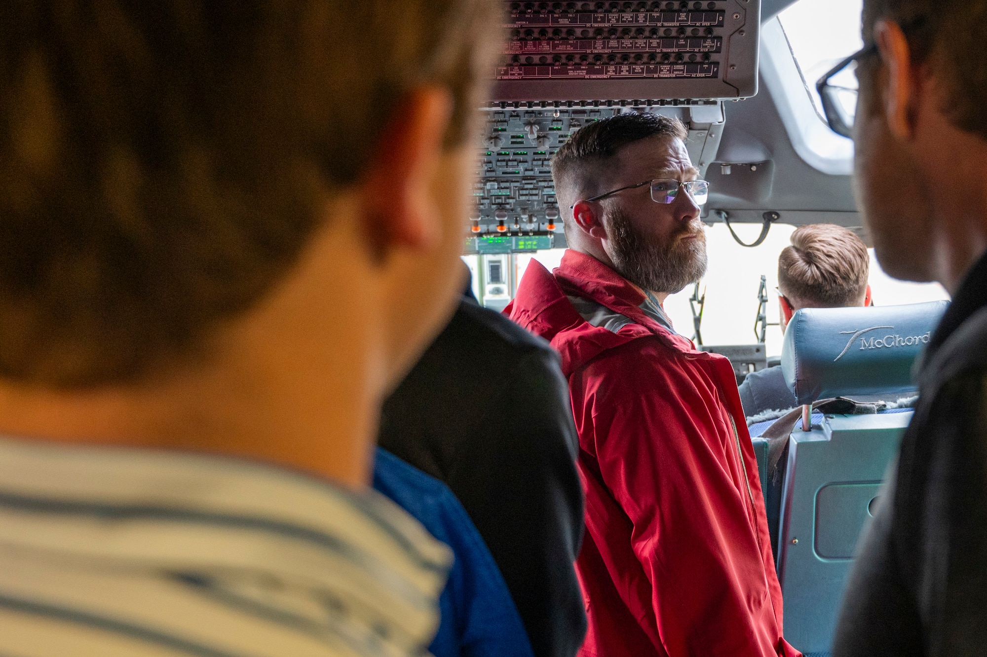 Nathan Miller, a Sandia National Laboratories Weapon Intern Program participant, inspects a C-17 Globemaster III flight deck at Joint Base Lewis-McChord, Washington, May 7, 2025.