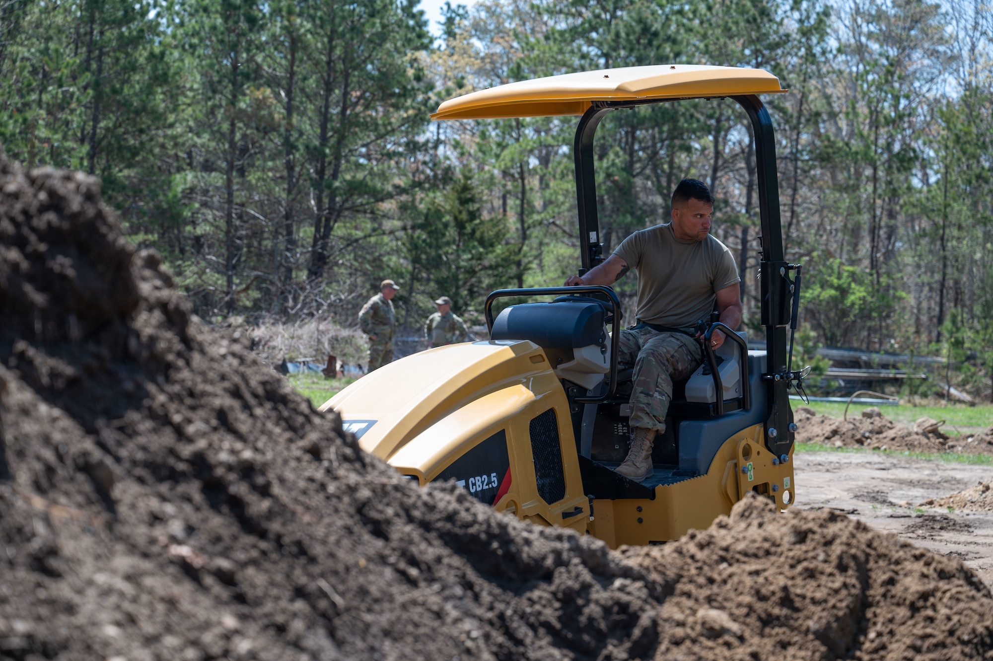 Airman drives a roller.