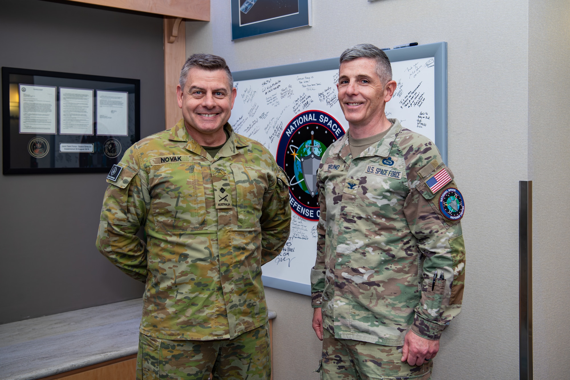 Two military men standing next to each other
