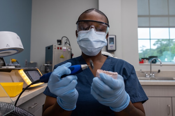 U.S. Navy Hospital Corpsman 3rd Class Niyona Gibbs, a dental technician with 2nd Dental Battalion, 2nd Marine Logistics Group, and a native of Bayboro, North Carolina, prepares a dental mold at Marine Corps Base Camp Lejeune, North Carolina, May 12, 2025. Gibbs was selected as the 2nd MLG Warrior of the Week by her leadership for her proficiency, maturity, and dedication to her job as a dental technician.  Her impact during exercise Joint Viking was remarkable where she assisted in the care of 200 patients and provided 75 hours of medical coverage during six training evolutions for the exercise. Each week, 2nd MLG recognizes one outstanding Marine or Sailor that goes above and beyond in their duties and embodies the qualities of an outstanding service member. (U.S. Marine Corps photo by Sgt. Alfonso Livrieri)