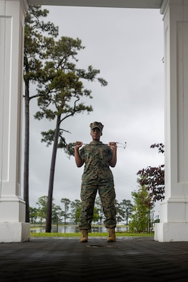 U.S. Navy Hospital Corpsman 3rd Class Niyona Gibbs, a dental technician with 2nd Dental Battalion, 2nd Marine Logistics Group, and a native of Bayboro, North Carolina, poses for a photo at Marine Corps Base Camp Lejeune, North Carolina, May 12, 2025. Gibbs was selected as the 2nd MLG Warrior of the Week by her leadership for her proficiency, maturity, and dedication to her job as a dental technician.  Her impact during exercise Joint Viking was remarkable where she assisted in the care of 200 patients and provided 75 hours of medical coverage during six training evolutions for the exercise. Each week, 2nd MLG recognizes one outstanding Marine or Sailor that goes above and beyond in their duties and embodies the qualities of an outstanding service member. (U.S. Marine Corps photo by Sgt. Alfonso Livrieri)