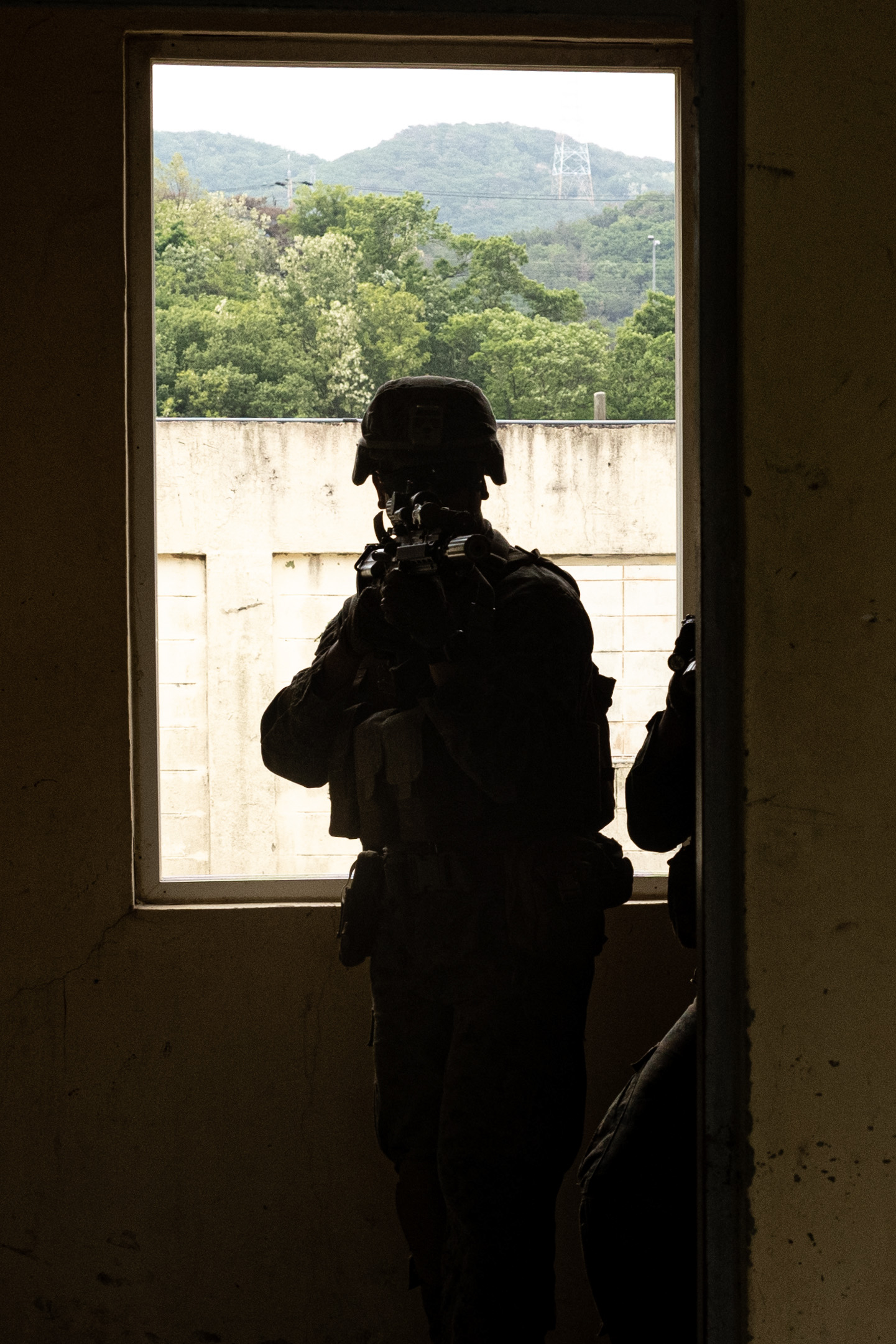 A U.S. Marine with 2nd Battalion, 23rd Marines, forward deployed with 4th Marine Regiment, 3d Marine Division as part of the Unit Deployment Program, conducts room clearings as a part of military operations in urban terrain training during Korea Viper 25.4 at Pohang, South Korea, May 11, 2025. Korea Viper is a recurring exercise series that demonstrates the Republic of Korea and U.S. Marine Corps' ability to respond decisively in the region as a singular, unified force while strengthening relationships and trust between the two allies. (U.S. Marine Corps photo by Lance Cpl. Tucker Mocan)